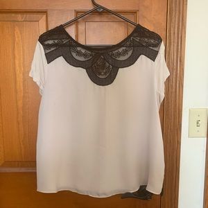 Women’s black lace trim on cream blouse